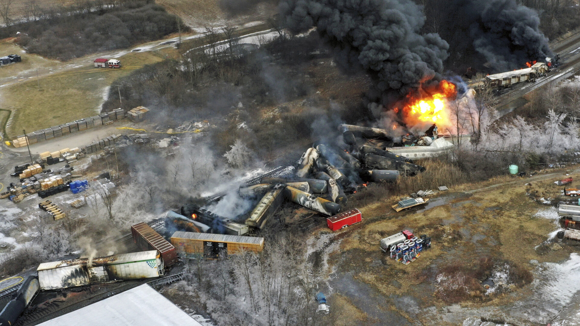 FILE - In this photo taken with a drone, portions of a Norfolk Southern freight train that derailed the previous night in East Palestine, Ohio, remain on fire at mid-day, Feb. 4, 2023. The costs associated with Norfolk Southern's fiery February derailment in Ohio have more than doubled to $803 million as the railroad works to clean up the mess and moves forward with all the related lawsuits. Norfolk Southern recorded another $416 million charge related to the East Palestine derailment on Thursday as part of its second-quarter earnings. (AP Photo/Gene J. Puskar, File)