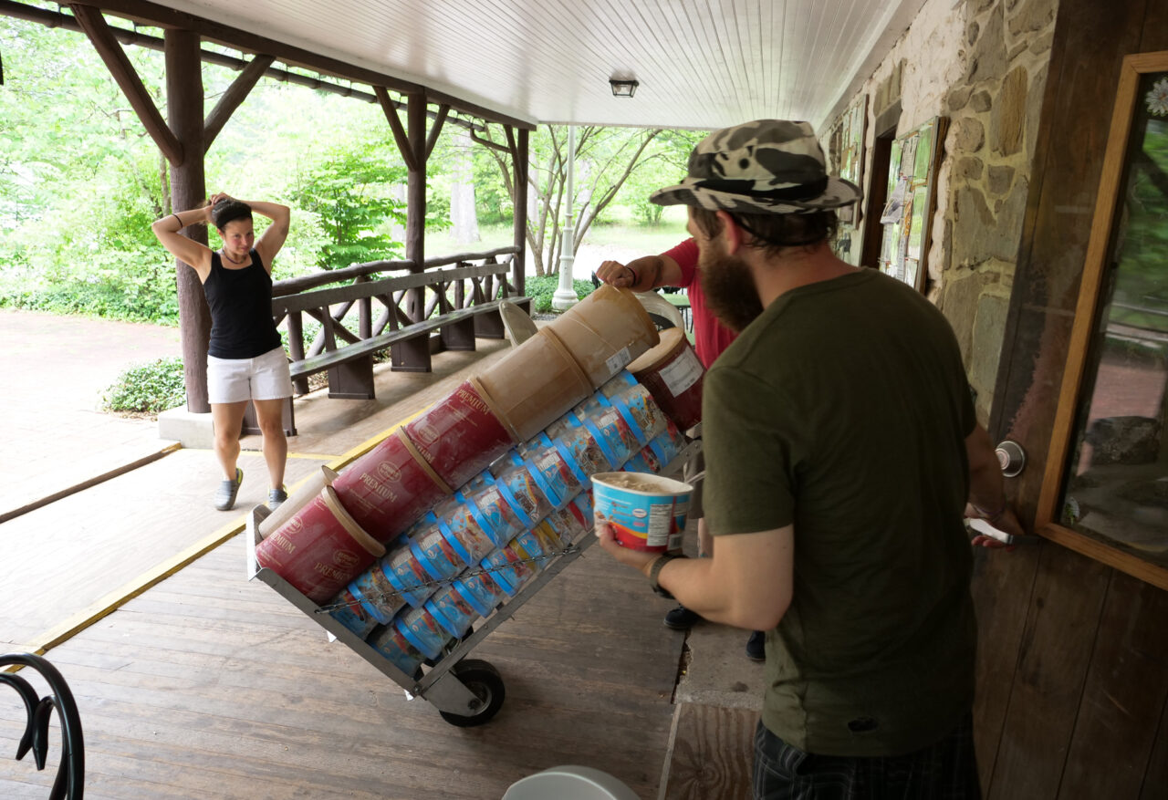 Alan "Legoman" Dwyer, 36, of New Hampshire holds the door for the Hershey's Ice Cream delivery man at the Pine Grove Furnace store on Tuesday, July 18, 2023.