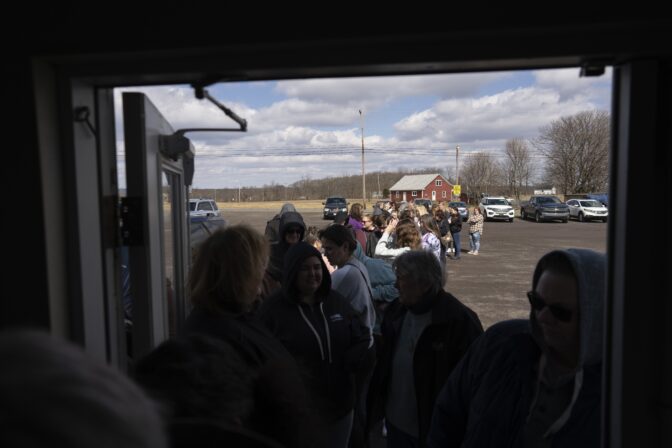 Ticket holders line up before the doors open for the sold-out "Drag Bingo" fundraiser at the Nescopeck Township Volunteer Fire Company Social Hall, in Nescopeck, Pa., Saturday, March 18, 2023.