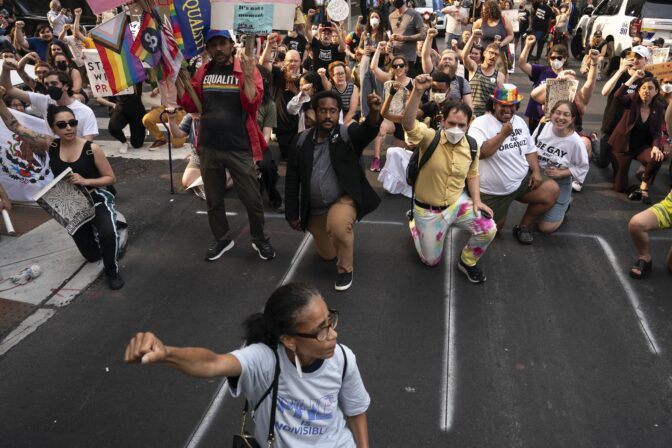 Demonstrators gather outside the Moms for Liberty meeting in Philadelphia, Friday, June 30, 2023.