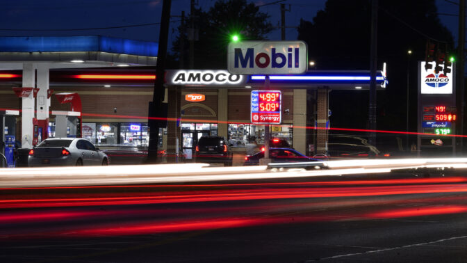 File - Motorists stop for fuel at gas stations in Detroit, Tuesday, July 5, 2022. If the auto industry boosts electric vehicle sales to the level the Environmental Protection Agency recommends, any reduction in pollution could prove more modest than the agency expects. The Associated Press has estimated that nearly 80% of vehicles being driven in the U.S. — more than 200 million — would still run on gasoline or diesel fuel.  (AP Photo/Paul Sancya, File)