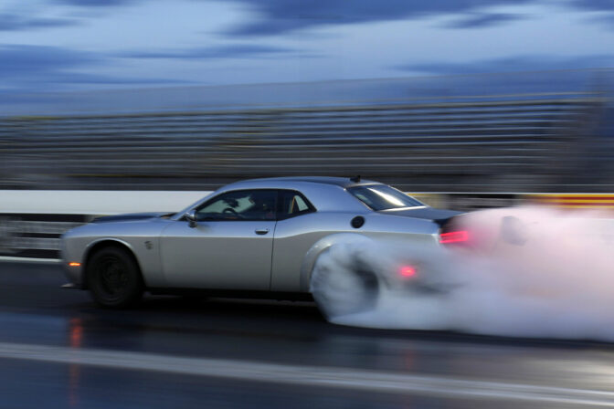 File - The 2023 Challenger SRT Demon 170 races down a drag strip at an event to unveil the car Monday, March 20, 2023, in Las Vegas. If the auto industry boosts electric vehicle sales to the level the Environmental Protection Agency recommends, any reduction in pollution could prove more modest than the agency expects. The Associated Press has estimated that nearly 80% of vehicles being driven in the U.S. — more than 200 million — would still run on gasoline or diesel fuel.