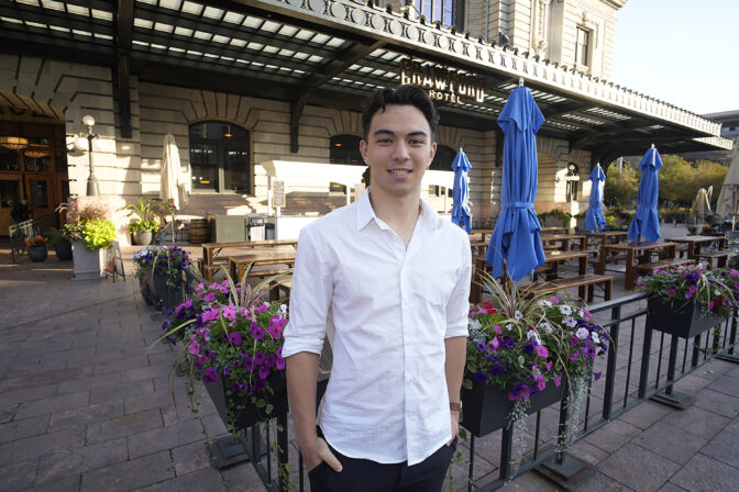 Ronan Takizawa, a student at Colorado College in Colorado Springs, Colo., is shown outside Union Station on the way to boarding a bus for his 65-mile commute to class from downtown Denver early Monday, Aug. 7, 2023, in Denver