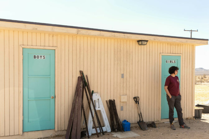 Christina Sanchez with the American Conservation Experience outisde of the seed bank inside historic Kelso Schoolhouse, Mojave National Preserve in San Bernardino County, California, Tuesday, August, 8th, 2023 Krystal Ramirez/ NPR