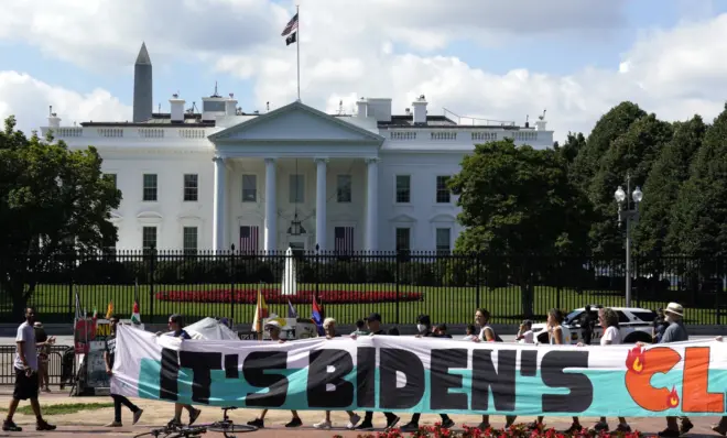 Climate activists rally in front of the White House at Lafayette Square to demand that President Joe Biden declare a climate emergency and move the country rapidly away from fossil fuels, July 4, 2023, in Washington. After being thwarted by Congress, Biden will use his executive authority to create a New Deal-style American Climate Corps that will serve as a major green jobs training program.
