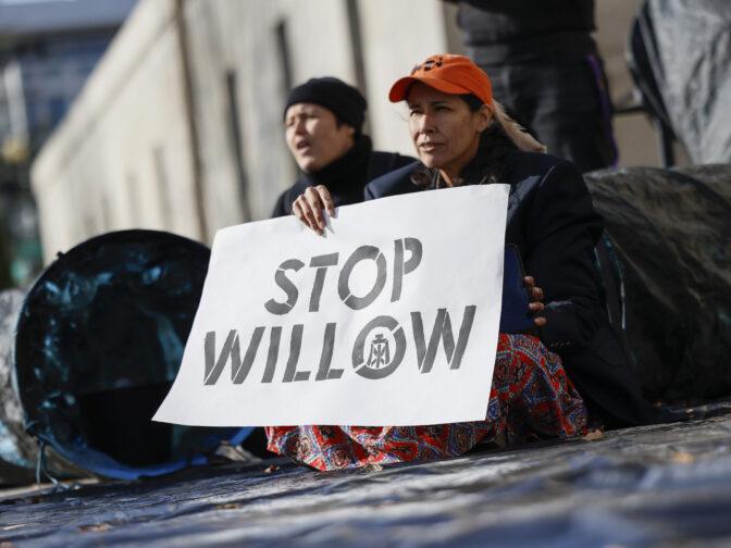 Climate activist hold a demonstration to urge President Biden to reject the Willow Project at the US Department of Interior on November 17, 2022 in Washington, DC. (Photo by Jemal Countess/Getty Images for Sunrise AU)