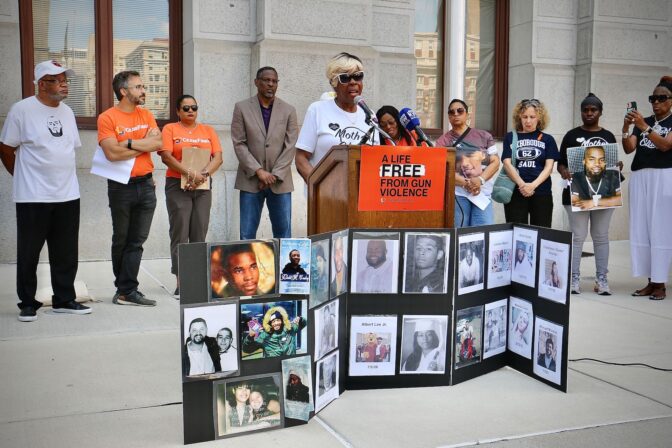 Photos of gun victims set the stage as survivors urge the Pennsylvania Supreme Court to overturn the state’s ban on local gun laws. (Emma Lee/WHYY)