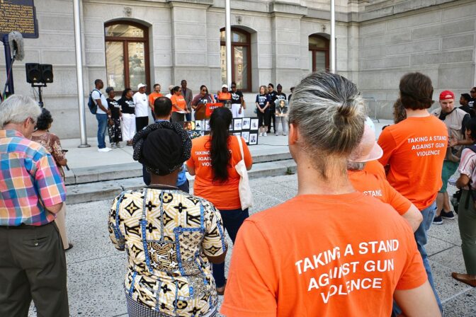 Anti-gun violence activists gather at Philadelphia City Hall on the eve of a state Supreme Court hearing that will decide whether their lawsuit to end the state’s ban on local gun laws will go forward. (Emma Lee/WHYY)