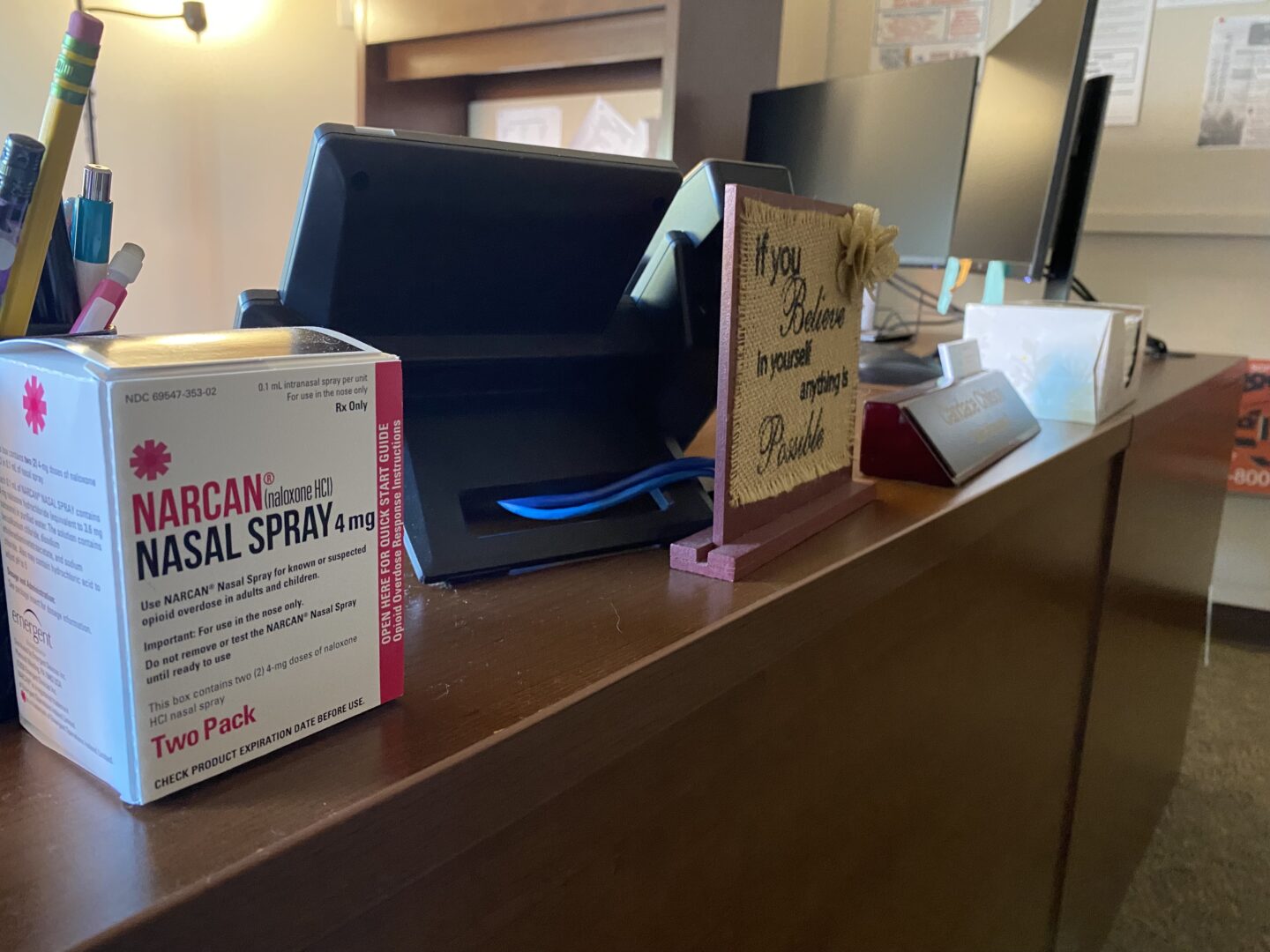 Sullivan County commissioners used a portion of opioid settlement money to hire a county case manager. Her desk includes a box of the opioid overdose-reversal drug Narcan.