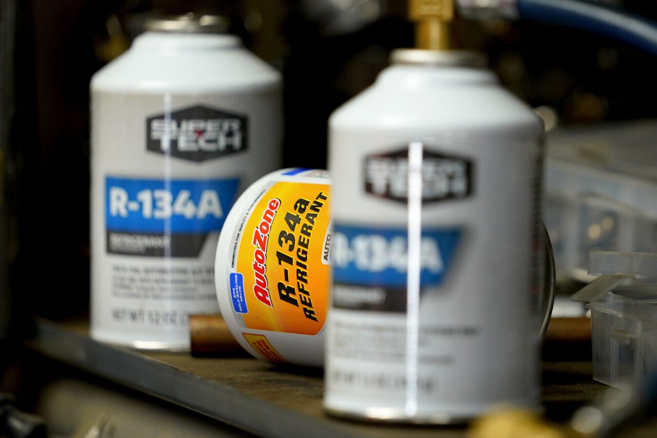 Cans of R-134A refrigerant sit on the shelves of Cary's Auto, Monday, Aug. 28, 2023, in Scottsdale, Ariz. Refrigerants are chemical fluids that have made air conditioning and refrigeration possible, but they are hundreds or even thousands of times more powerful at warming the planet than carbon dioxide, the most notorious greenhouse gas. (AP Photo/Matt York)