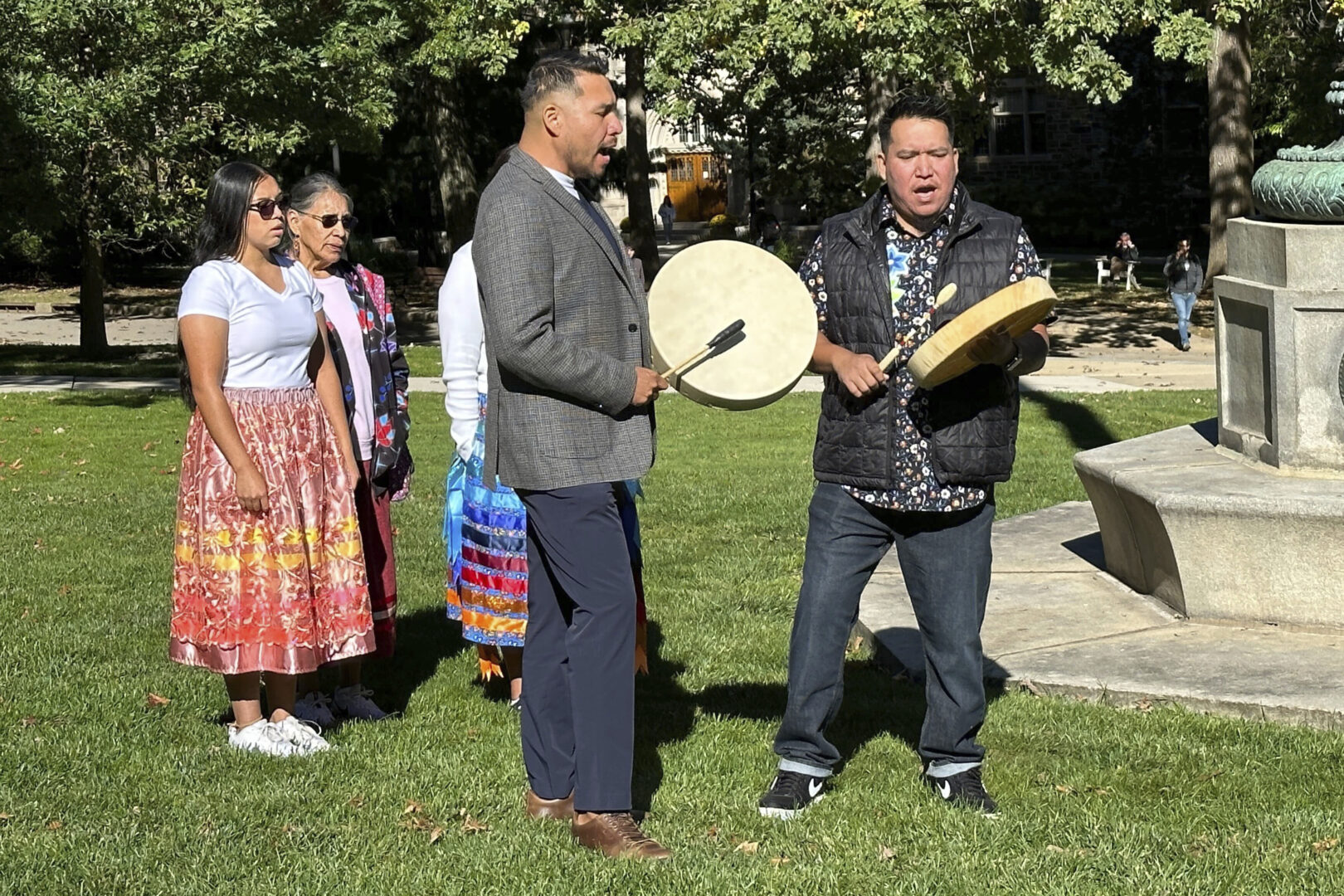 Jason Hale, center with drum, from the Institute for Indigenous Studies at Lehigh University, sings an indigenous song during a ceremony announcing the Indigenous Peoples Cultural and Heritage Tourism Initiative, Friday, Oct. 13, 2023, at Lehigh University in Bethlehem, Pa. Pennsylvania's lack of federally recognized tribal nations means there's been an incomplete picture of its Native American culture and history, officials said Friday, announcing a grant-funded program designed to change that. 