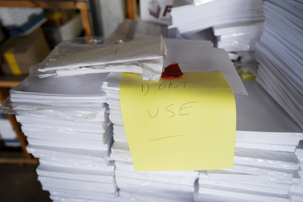 Stacks of paper too thick for Luzerne County's election equipment are seen in the county's warehouse in Wilkes-Barre, Pa., Wednesday, Sept. 13, 2023. (AP Photo/Sait Serkan Gurbuz)
