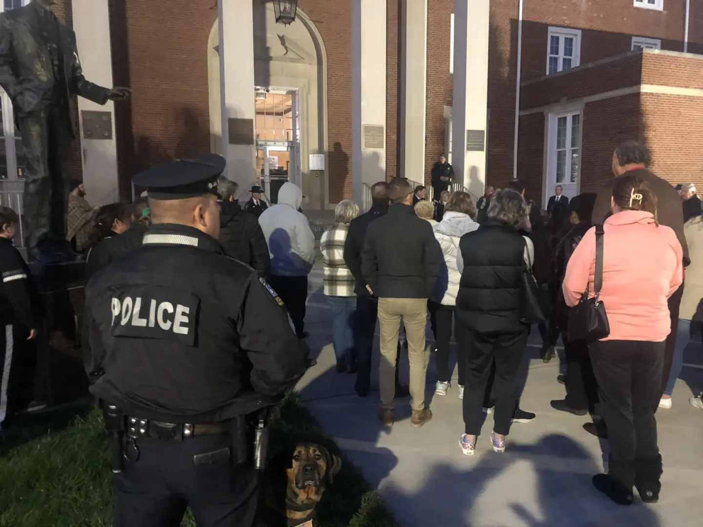 Community members stand outside the Indiana County Courthouse for a vigil after a shooting near IUP's campus.