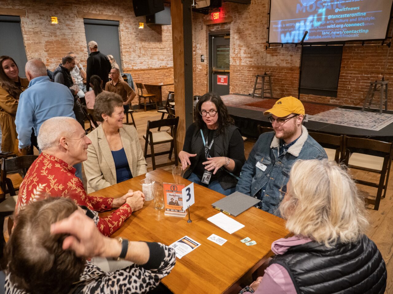 LNP managing editor of content Stephanie Zeigler and WITF democracy beat reporter Robby Brod speak to people at the News & Brews at the Lititz Shirt Factory on Thursday, Oct. 19, 2023.