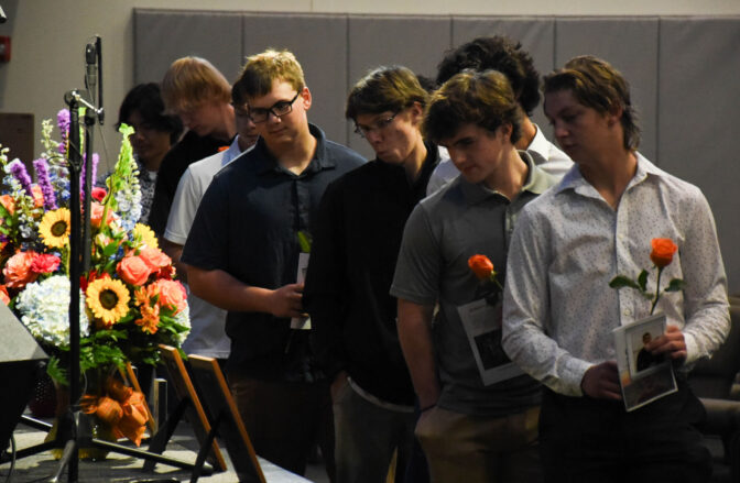 Members of the local high school’s baseball team individually brought a single rose to hand to Patricia Coburn, of Palmyra, during the celebration of life to honor Alex Coburn at Palmyra Grace Church Saturday, Nov. 4, 2023.