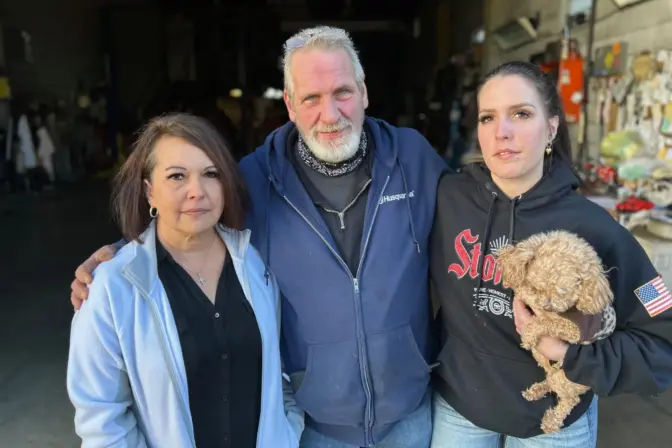 Donna Hoadwonic (left) and James and Katie Cross outside James' auto repair shop in Yukon. They want the landfill shut down. Photo: Reid R. Frazier / The Allegheny Front