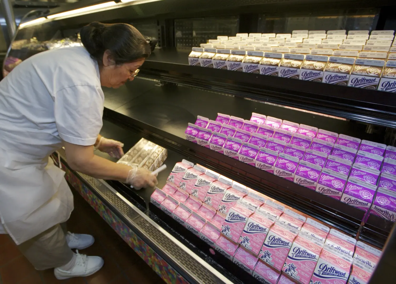 In this file photo, cafeteria manager Carol Avalos sorts individual milk cartons at the Belmont Senior High cafeteria in Los Angeles. School cafeterias in Pennsylvania and nationally are feeling the impact of a shortage of the cartons used to package milk.
