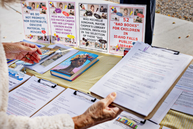Parents Against Bad Books founder Carolyn Harrison set’s up her booth to collect signatures and protest obscene literature being available at the public library outside of Idaho Falls Public Library on Wed., October 4, 2023, in Idaho Falls, ID.