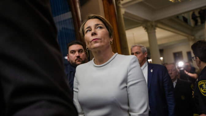 January 5, 2023 - Maura Healey waits to be escorted by the sergeant of arms into the House Chamber to take the oath of office to become the next Governor of Massachusetts. And along with Oregon Gov.-elect Tina Kotek, she becomes one of the first lesbian governors in U.S. history. (Jesse Costa/WBUR)