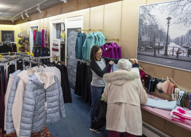 Julie Jackel helps a customer in her store, the Crooked Hem, in Kane, Pennsylvania.