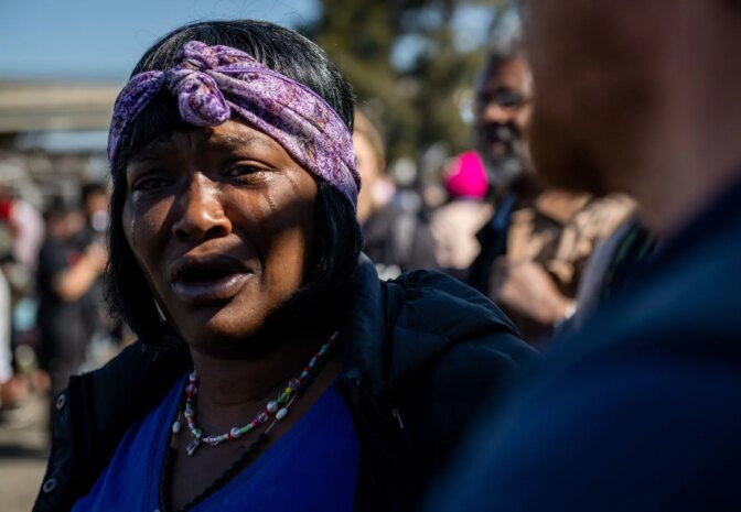 Wood Street resident Mayana Sparks cries while watching the City of Oakland begin to evict the encampment in Oakland on April 10, 2023.