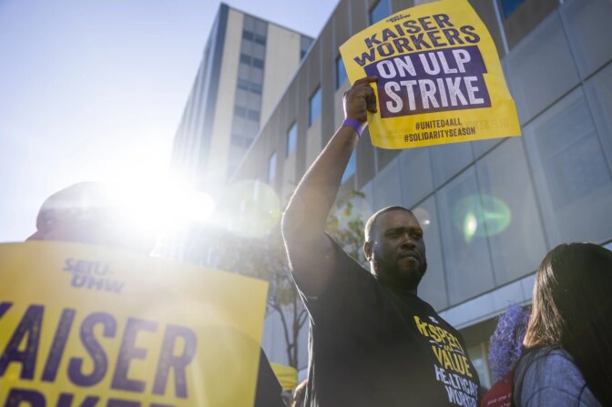 Michael Jones and others strike at the Kaiser Permanente Oakland Medical Center in Oakland on Oct. 4, 2023.