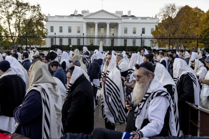 A large crowd of people gathered in front of the White House for morning prayers on the day of the March for Israel.
