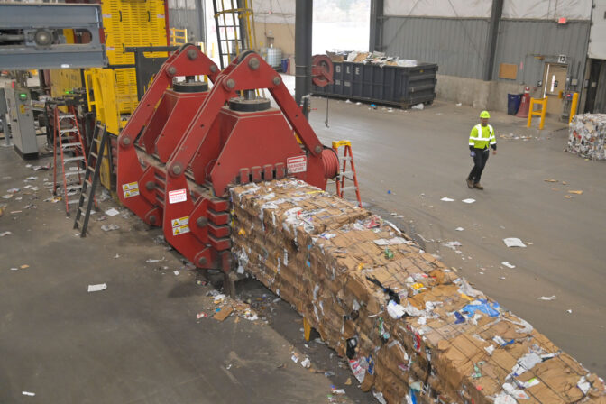 After all the material is entered onto conveyor belts and separated at the Penn Waste facility in York, a large bailer bundles the remaining products where it then goes to be further recycled on Tuesday, Nov. 21, 2023.