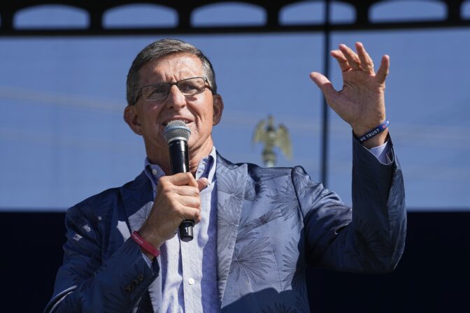 FILE - Former national security adviser Michael Flynn speaks during a "rosary rally" on Sunday, Aug. 6, 2023, in Norwood, Ohio. Former President Donald Trump urged supporters to “guard the vote” during next year's election, a phrase that set off alarm bells among pro-democracy advocates who say it signals permission to his followers to take extreme measures. Flynn, has spent months repeating the phrase.  (AP Photo/Darron Cummings, File)