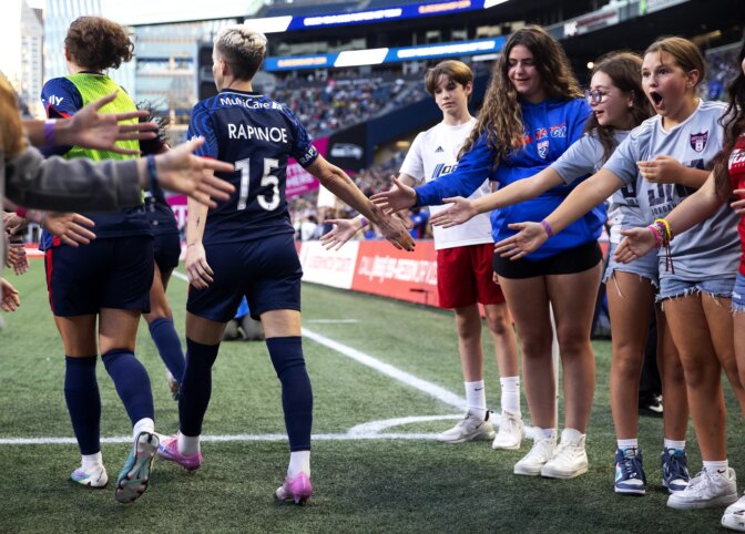 Young fans react after high-fiving OL Reign forward Megan Rapinoe as she walks onto the field to play her final NWSL regular-season home game against the Washington Spirit on Friday, October 6, 2023, at Lumen Field in Seattle. KUOW Photo/Megan Farmer