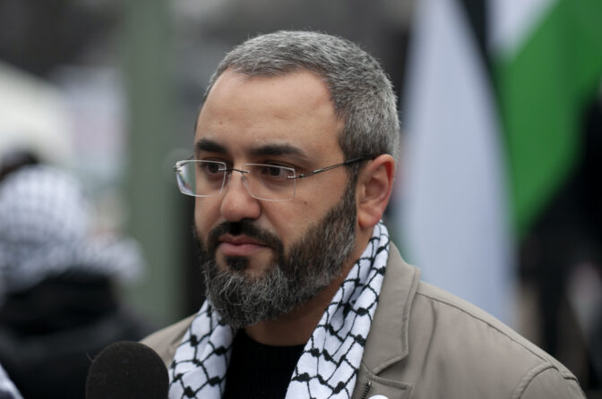 Karim Alshurafa speaks to the media as hundreds gathered at the state capitol building and marched to the governor's residence in Harrisburg on Dec. 10, 2023 calling for a permanent cease fire in the war between Israel and Palestine. Jeremy Long - WITF