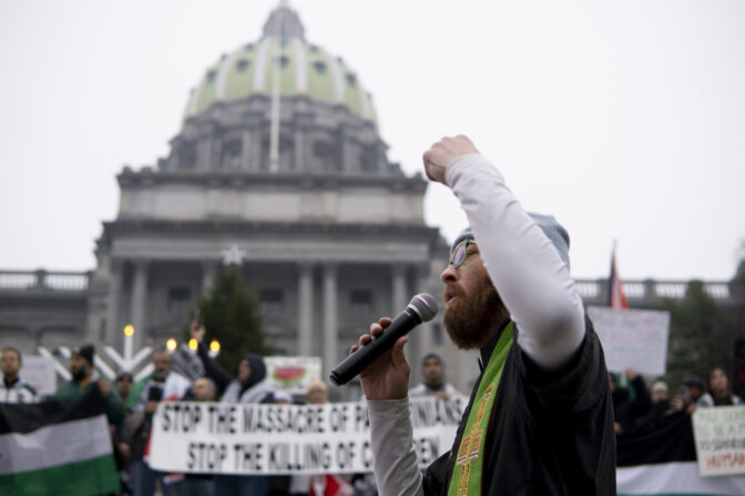 Rev. Chad Collins speaks as hundreds gathered at the state capitol building and marched to the governor's residence in Harrisburg on Dec. 10, 2023 calling for a permanent cease fire in the war between Israel and Palestine. Jeremy Long - WITF