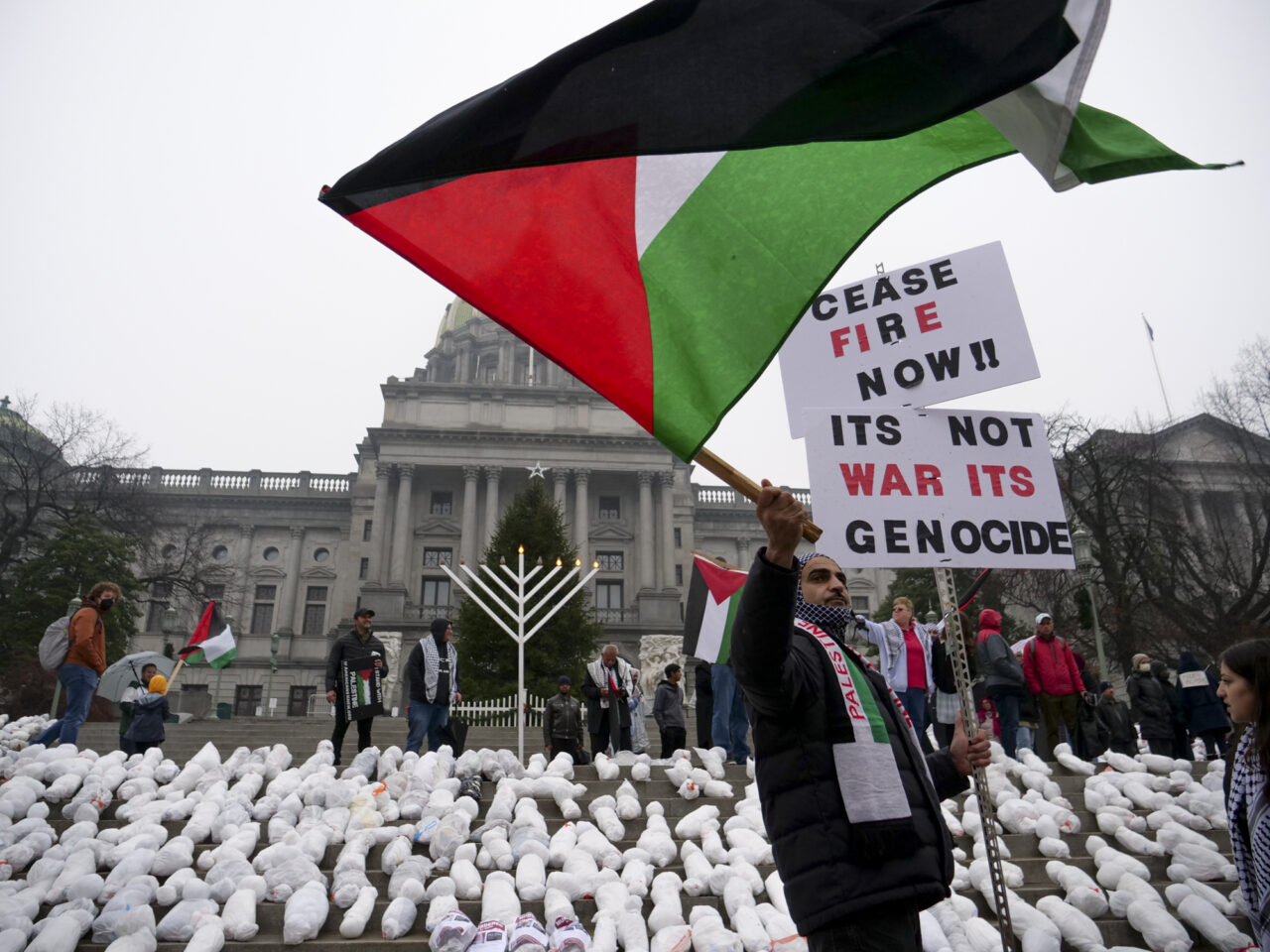 Mike Shaw demonstrates as hundreds gathered at the state capitol building and marched to the governor's residence in Harrisburg on Dec. 10, 2023 calling for a permanent cease fire in the war between Israel and Palestine. Jeremy Long - WITF
