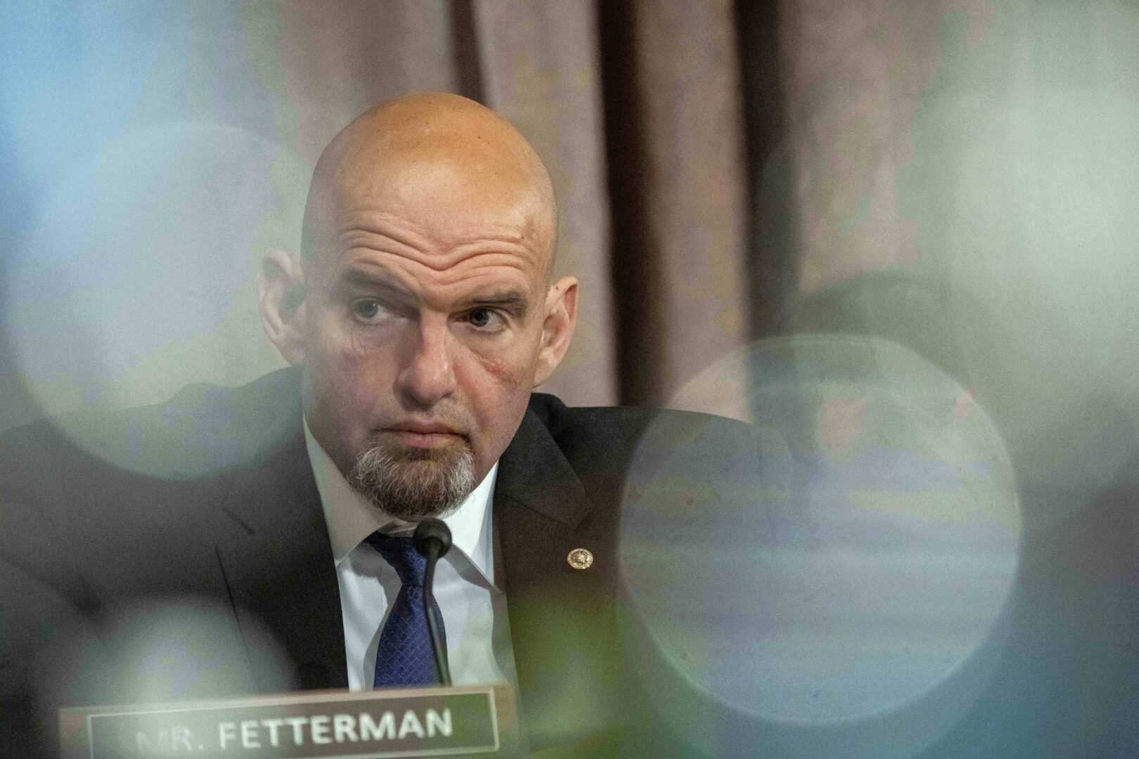FILE - Sen. John Fetterman, D-Pa., listens during a confirmation hearing of Jared Bernstein to be the chair of the White House Council of Economic Advisers, on Capitol Hill, Tuesday, April 18, 2023, in Washington. The first-term Pennsylvania Democrat held a deeply personal and introspective interview with NBC’s “Meet the Press” that aired Sunday, Dec. 31. (AP Photo/Alex Brandon, File)