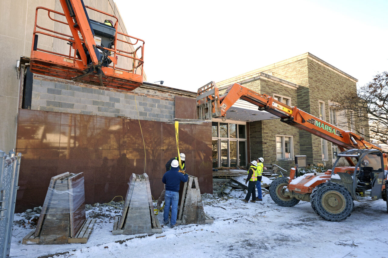 Workers begin demolition Wednesday, Jan. 17, 2023, at the Tree of Life building in Pittsburgh, the site of the deadliest antisemitic attack in U.S. history, as part of the effort to reimagine the building to honor the 11 people who were killed there in 2018. The demolition work began slowly, with crews picking away at the building's exterior. The new building will include spaces for worship and a museum, and will house community activities and programming about antisemitism. (AP Photo/Gene J. Puskar)