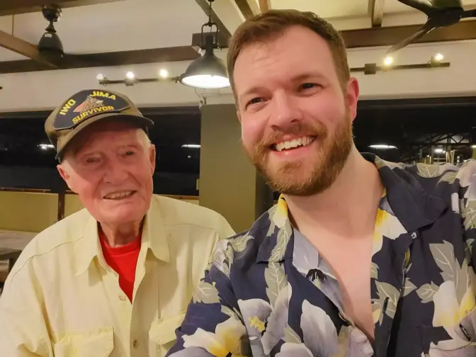Jared Frederick poses with Nils Mockler, a veteran who survived Iwo Jima.