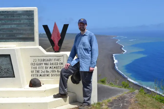 Jared Frederick stands at a memorial on top of Mt. Suribachi. He teaches history at Penn State Altoona and is the host of the new documentary “I Hiked Iwo Jima: A Virtual World War II Battlefield Tour.”