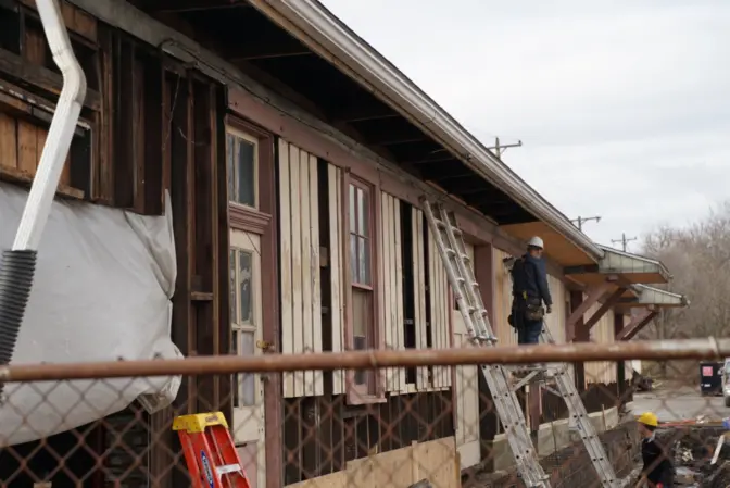 Construction workers at the old train depot in East Palestine repair the old train depot in East Palestine, which Norfolk Southern is renovating and donating to the village.