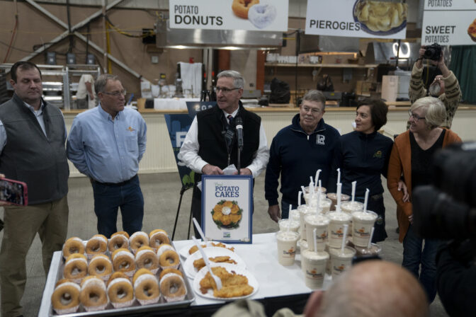 Agriculture Secretary Russell Redding stands before a table of fair offerings that will be served at the 2024 Pennsylvania Farm Show. Ben Wasserstein- WITF