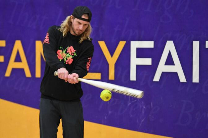 Travis Jankowski hits the softball with a bat during the clinic at Lancaster Catholic high school in Manheim Township on Sunday, Feb. 4, 2024.