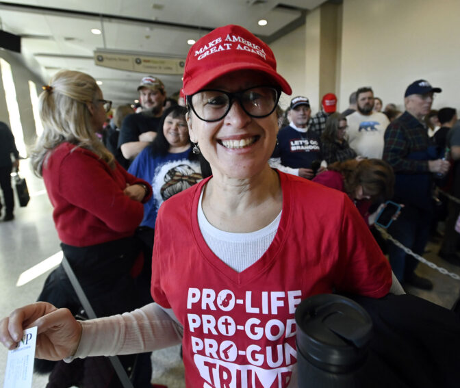 Alicia Figueroa, from Lower Paxton Twp., stands in line before former President Donald Trump speaks during an NRA sponsored event at the Great American Outdoor Show in Harrisburg on Friday Feb. 9, 2024.