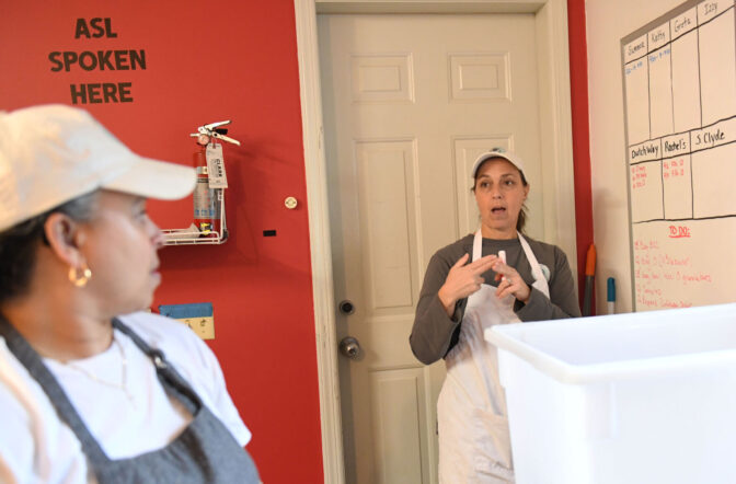 Owner Greta Fairbanks talks with Kathy Zimmerman on what to do In the kitchen within the garage at a home of owner in Manheim Township Thursday Feb. 8, 2024.