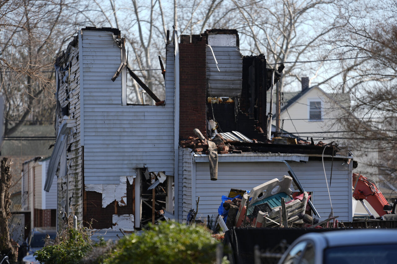 A home destroyed by from fire is shown in East Lansdowne, Pa., Thursday, Feb. 8, 2024. Authorities were searching the charred remains of the suburban Philadelphia home Thursday morning, a day after a shootout and fire left two police officers wounded and at least six people unaccounted for. (AP Photo/Matt Rourke)