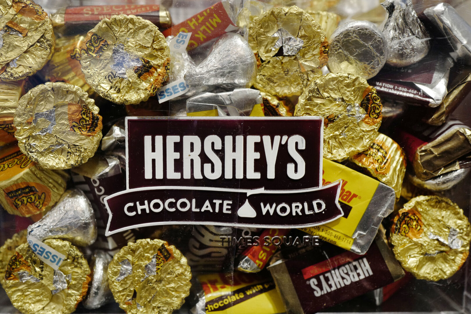 FILE - A mixture of Hershey's chocolates is displayed in the company's Times Square store, March 1, 2017, in New York. Hershey is cautioning on its 2024 profit growth as the company contends with rising cocoa costs that are leading to higher prices for chocolate. Cocoa futures prices have doubled over the past year and hit an unprecedented $5,874 per metric ton Friday, Feb. 9, 2024, in intraday trading. (AP Photo/Mark Lennihan, File)