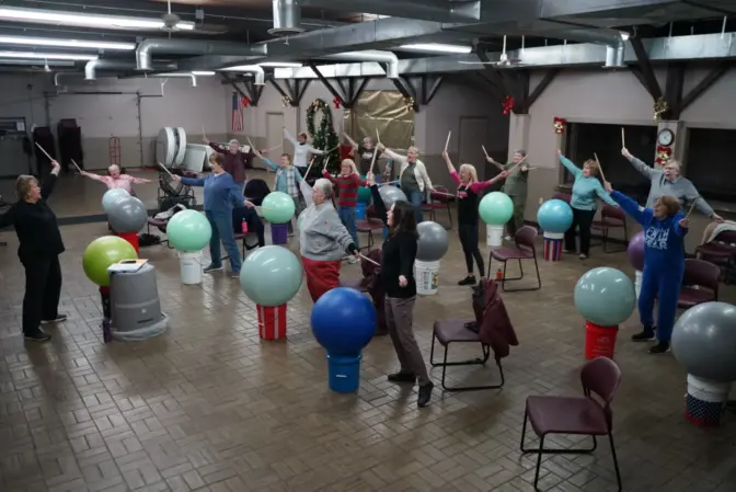 Barb Kliner leads workout classes for senior citizens at the community center in the village park.