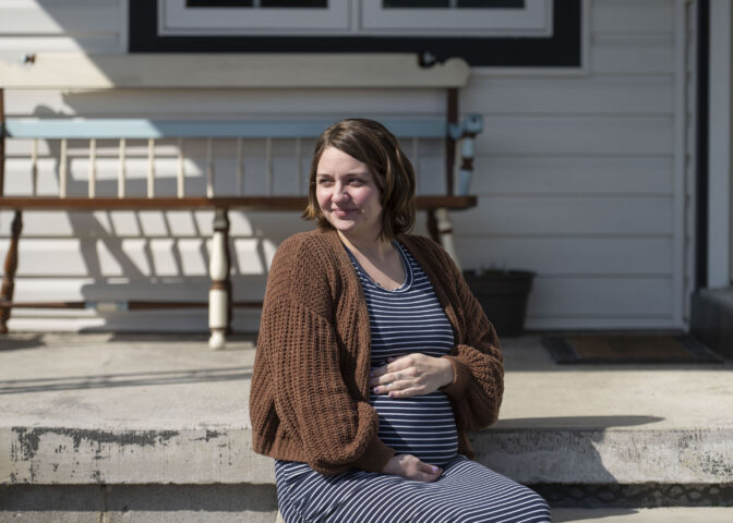 Jessie Larabee, who is pregnant, poses for a photograph outside her St. Marys home.