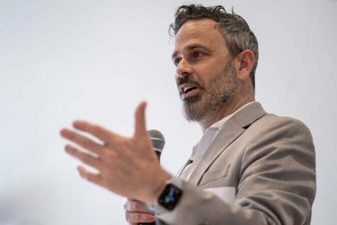 Gabe Klein, executive director of the Joint Office of Energy and Transportation at the U.S. Department of Energy, speaks during a Forth Design and Fund Equitable Electric Transportation For Communities workshop in Washington, Thursday, March 14, 2024. Convincing consumers to go electric, even if they don’t have their own home outlet to plug into, is the mission of the Joint Office of Energy and Transportation. (AP Photo/Nathan Howard)