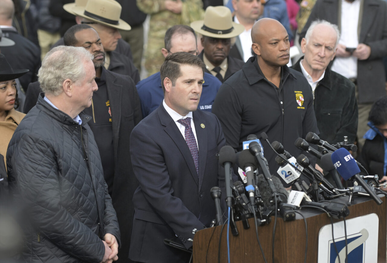 From left, Sen. Chris Van Hollen (D-Md.), Bill DelBagno, FBI special agent in charge of the Baltimore field office, Maryland Gov. Wes Moore and Paul J. Wiedefeld, Maryland's transportation secretary, hold a news conference near the scene where a container ship collided with a support on the Francis Scott Key Bridge, Tuesday, March 26, 2024 in Baltimore. The major bridge in Baltimore snapped and collapsed after a container ship rammed into it early Tuesday, and several vehicles fell into the river below. Rescuers were searching for multiple people in the water. (AP Photo/Steve Ruark)