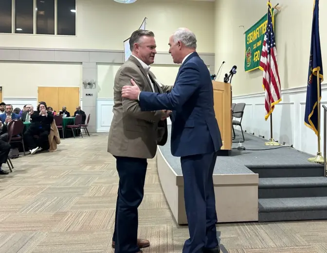 Sen. Bob Casey greets Steamfitters Local 420 president Jim Snell after speaking at a public meeting on the MACH2 hydrogen hub at the union’s headquarters in Northeast Philadelphia. (Susan Phillips/WHYY)