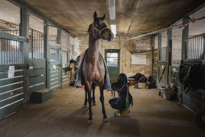 Tajee McLaughlin, 14, grooms his horse, Shady, at the Northwestern Stables in Philadelphia, PA, on Saturday March 30 2024. McLaughlin has been part of the Work to Ride program since he was 11 years old.